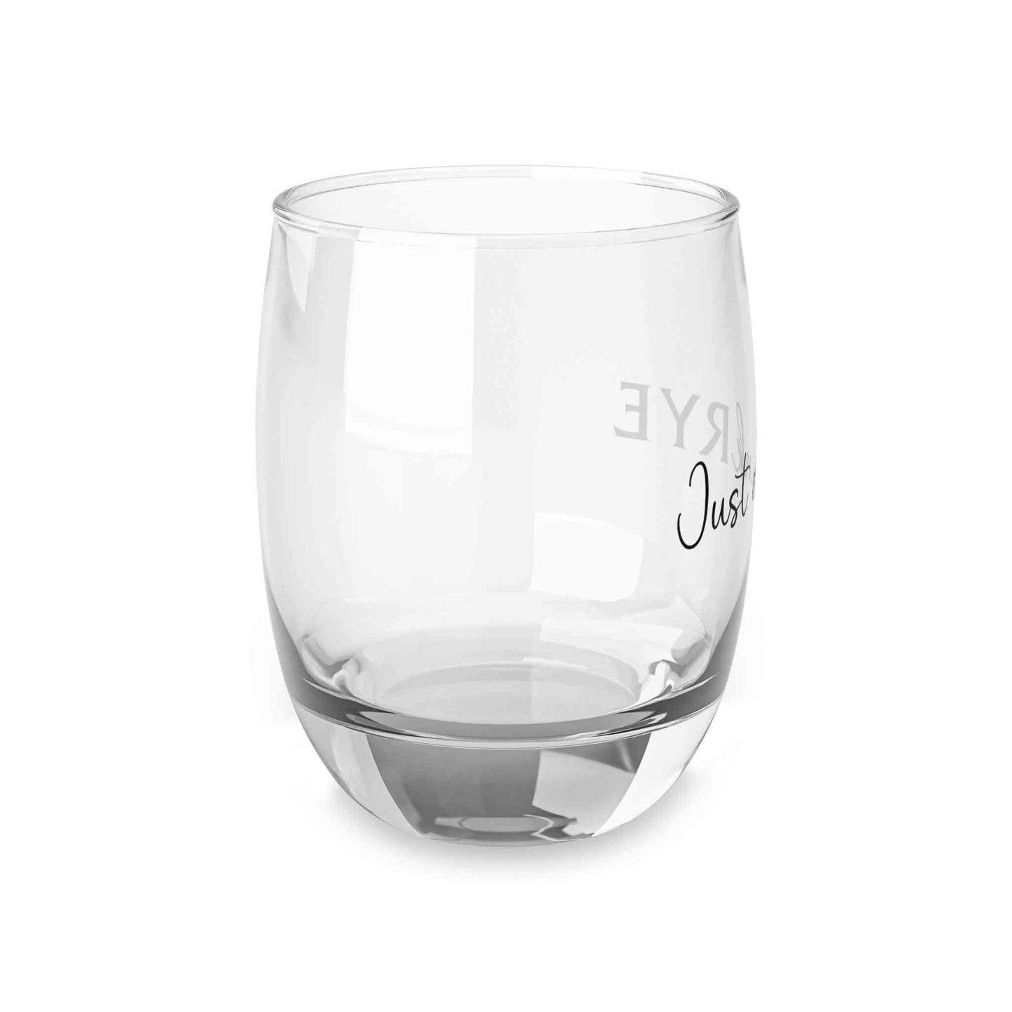 Angled view of stylish rye whiskey glass with modern typography, combining elegance and humor for whiskey lovers.