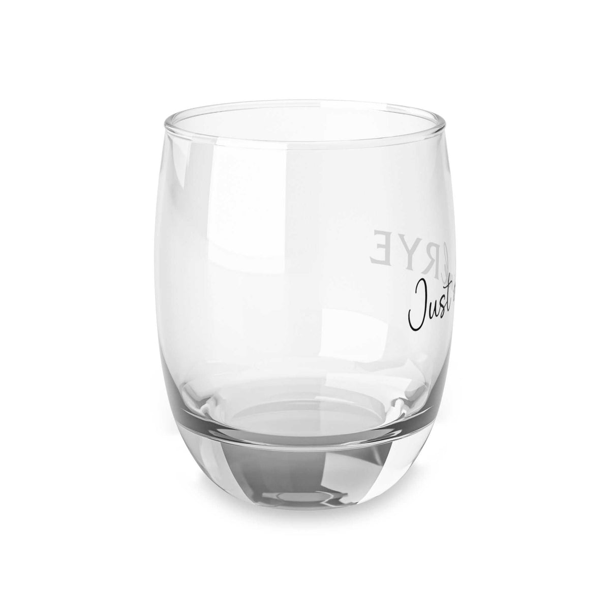 Angled view of stylish rye whiskey glass with modern typography, combining elegance and humor for whiskey lovers.
