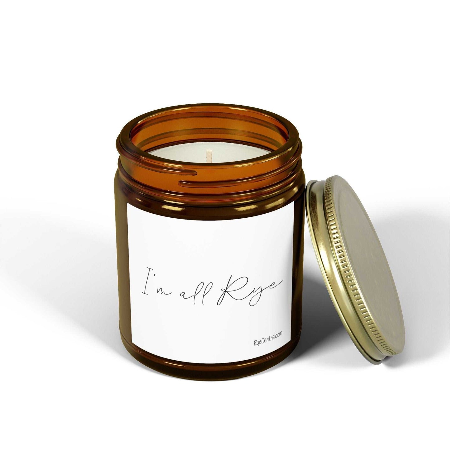 Amber glass candle with open gold lid and 'I'm All Rye' label, ideal for whiskey lovers and elegant home decoration.