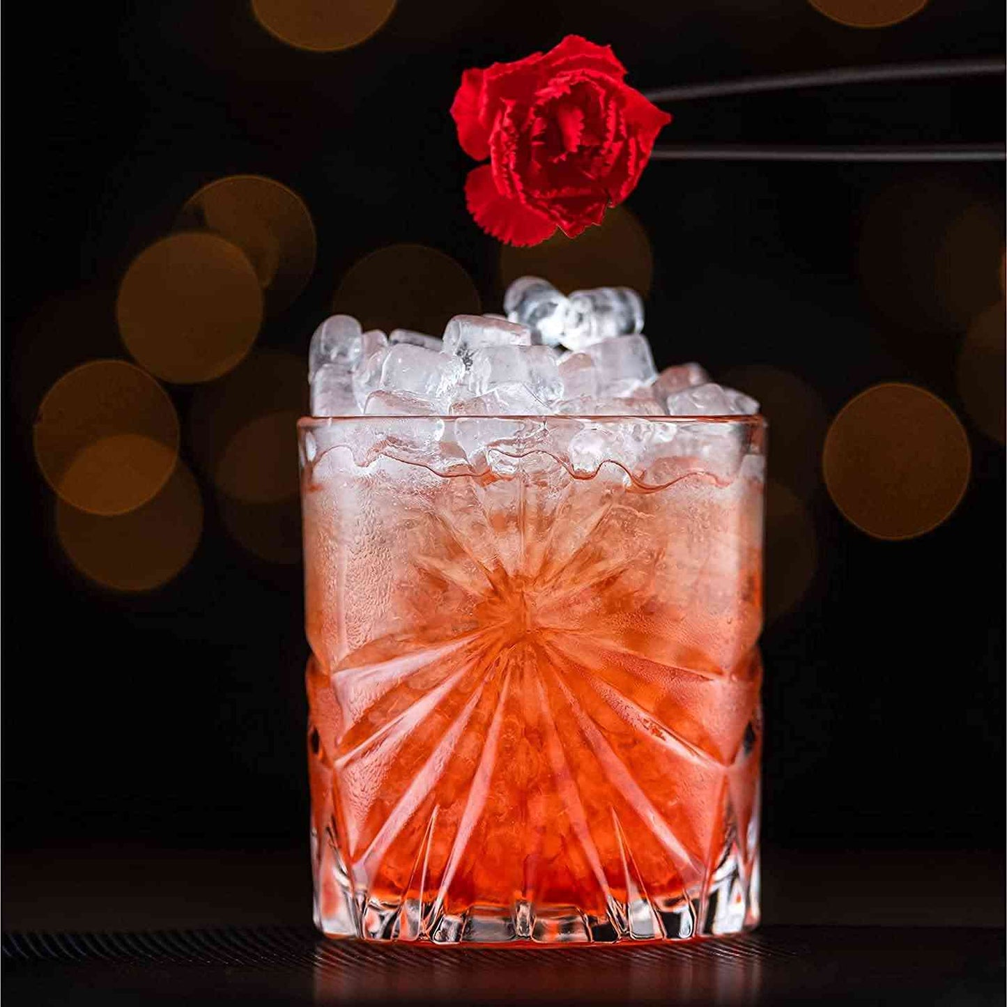 The Whiskey Connoisseur's Set - Soleil Glass Edition crystal glass filled with crushed ice and cocktail, garnished with a red flower.