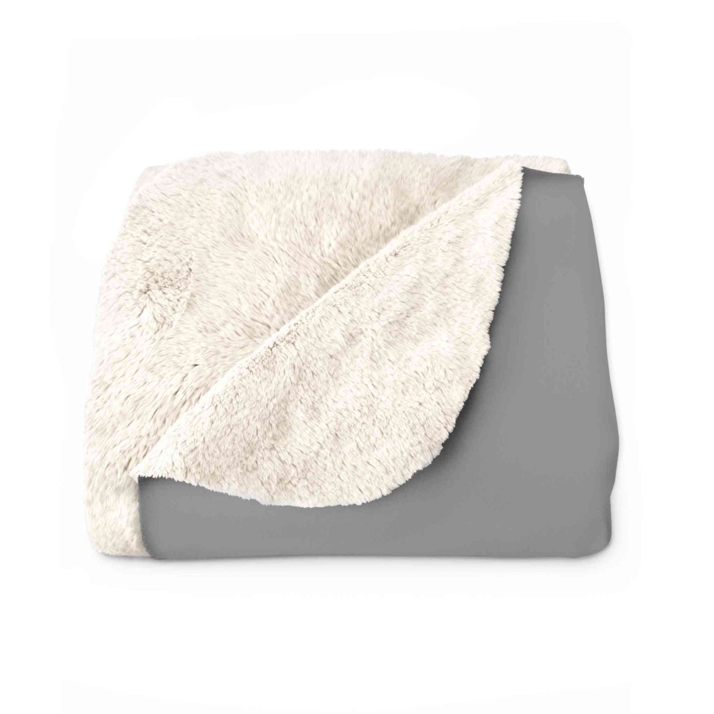 Folded sherpa blanket showing soft cream fleece lining and smooth gray exterior, combining comfort and whiskey-themed style for home use.