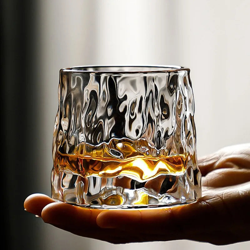 Stylish textured whisky tumbler with amber liquid for upscale tableware