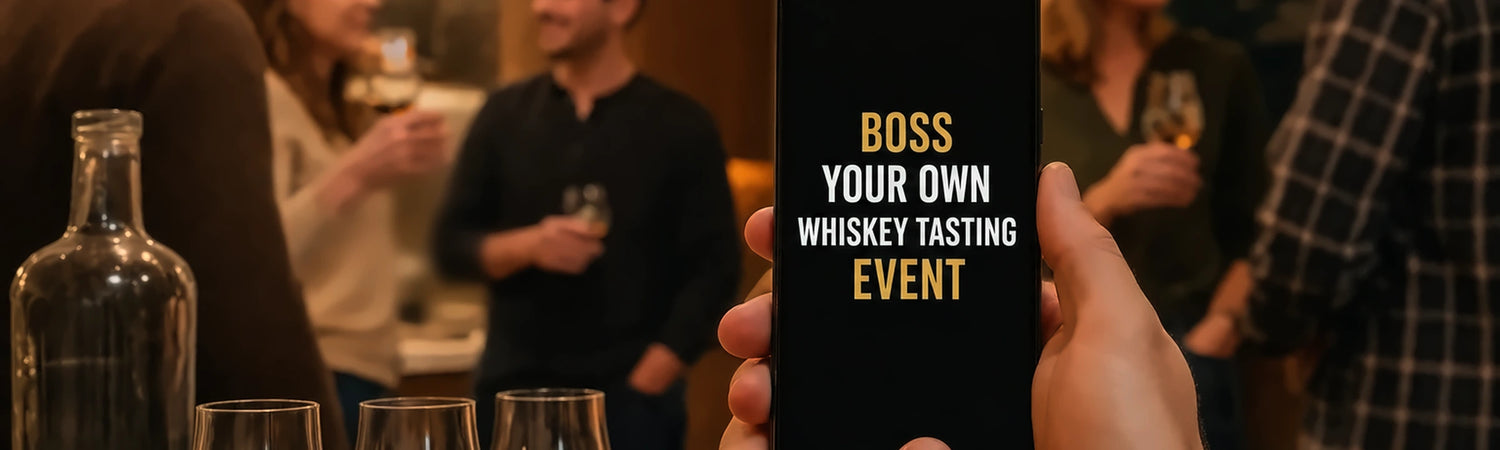 Hand holding a smartphone with glowing tasting app beside whiskey in a modern kitchen