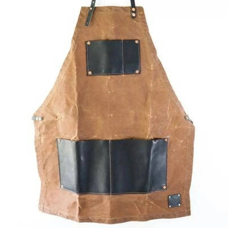 Rugged whiskey apron with leather pockets and durable canvas design.