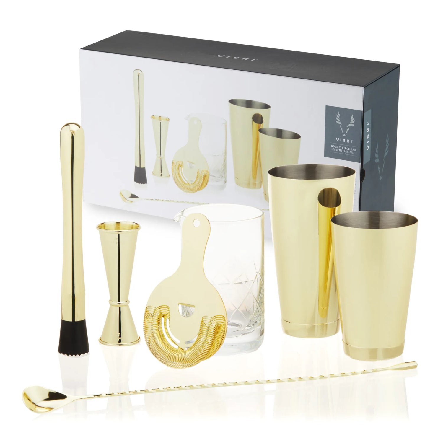 Luxury gold whiskey bar tool set with shaker, jigger, and strainer.