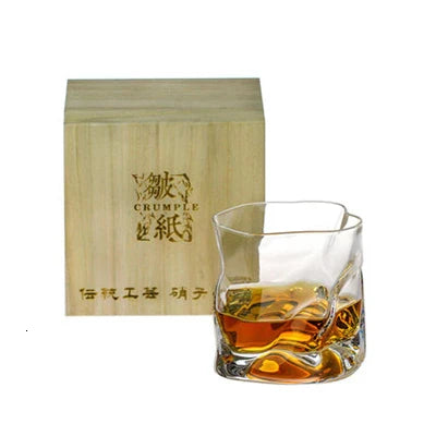 Elegant crystal whiskey glass with unique design and wooden box