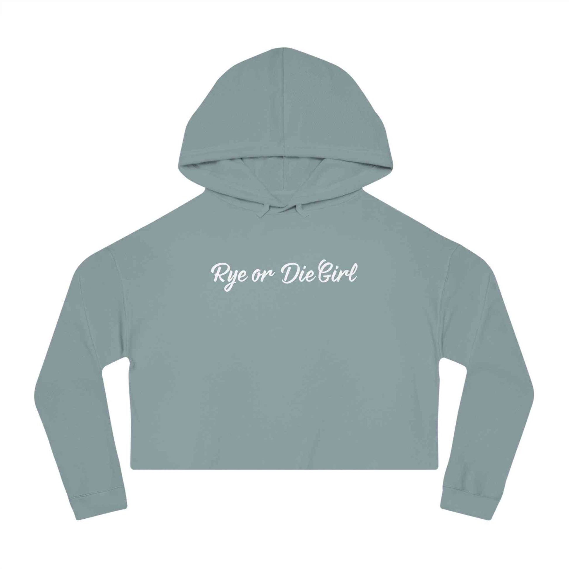 Cropped whiskey sweatshirt hoodie in dusty teal with 'Rye or Die Girl' text, combining comfort and fashion-forward appeal.