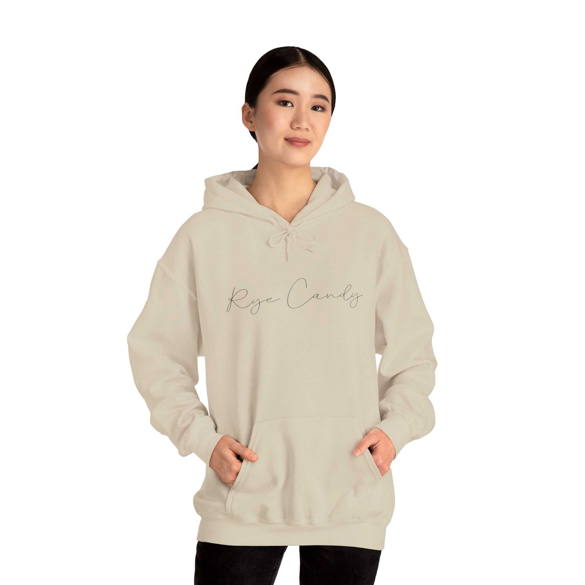 Graphic Whiskey Hooded Sweatshirt in beige with 'Rye Candy' script, modeled for cozy and stylish whiskey-themed fashion appeal.
