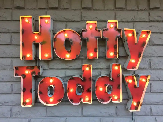 University of Mississippi 'Hotty Toddy' lighted recycled metal wall decor with vintage red letters and warm bulbs, ideal for accent décor.
