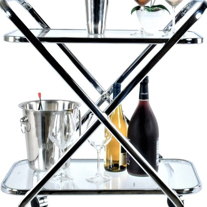 Chrome Xshape bar cart with floral decor and barware, designed for elegant entertaining in kitchen and dining settings.