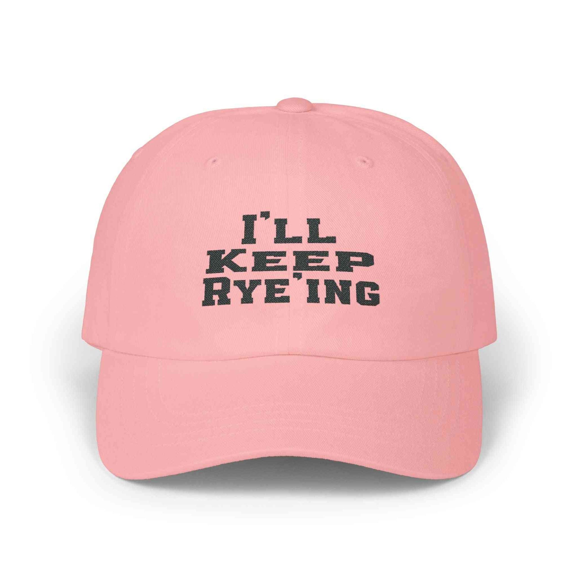 Pink Golf Dad Cap with black 'I’ll Keep Rye’ing' embroidery, a fun and stylish whiskey gift for casual wearers.