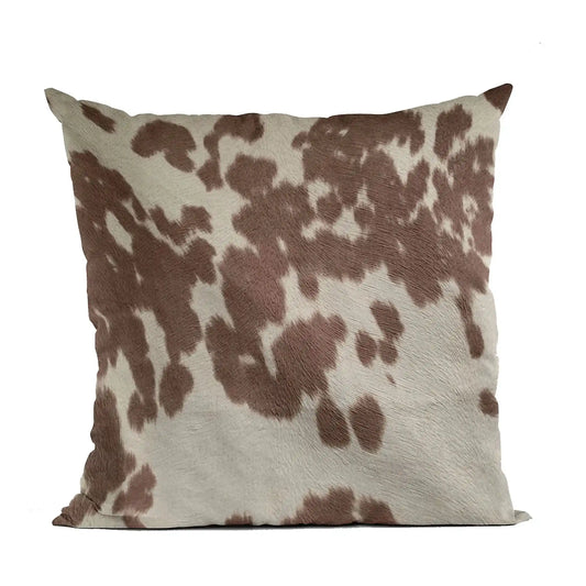 Premium cowhide throw pillow with brown and white spotted pattern, ideal for whiskey lovers seeking rustic home decor accents.