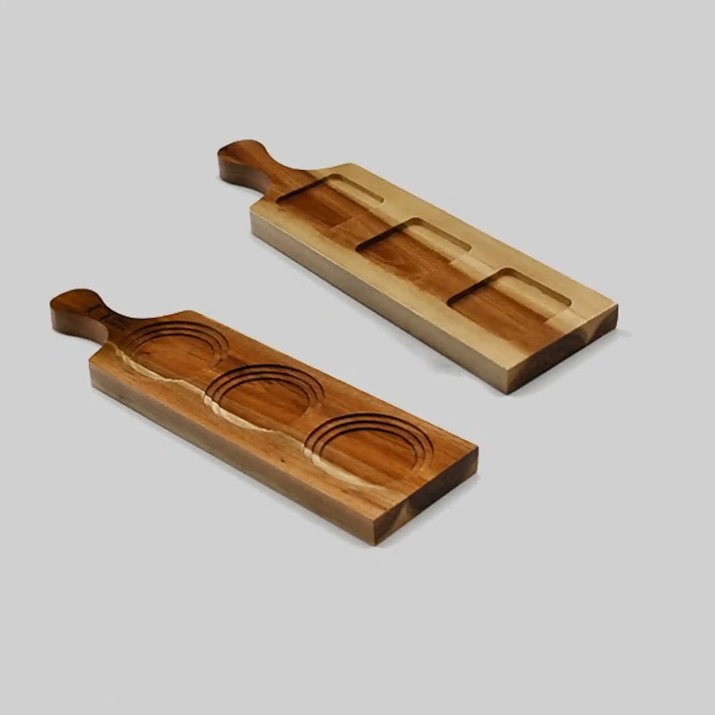 Acacia Flight Board holding a ramekin on grass, showcasing its versatility for whiskey tastings or serving desserts outdoors.