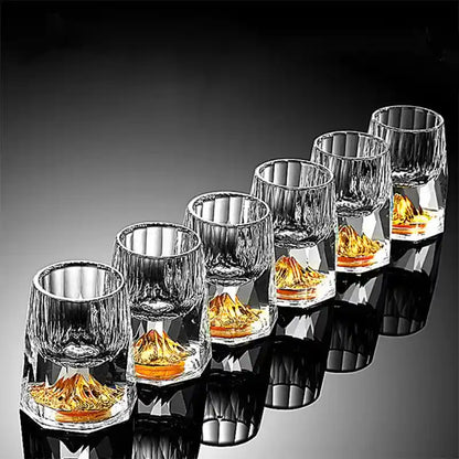 Set of six crystal glass wine glasses with gold foil mountain design, ideal for whiskey, vodka, and cocktail drinks in luxury bar settings.