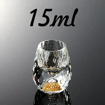 15ml diamond-cut crystal shot glass with rounded shape and gold foil base, perfect for upscale liquor presentation.