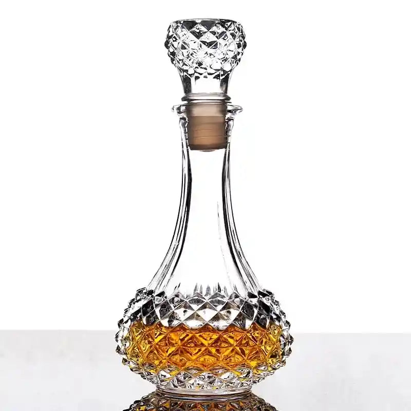 Diamond-patterned crystal glass decanter filled with whiskey, ideal for elegant liquor presentation in home bars.