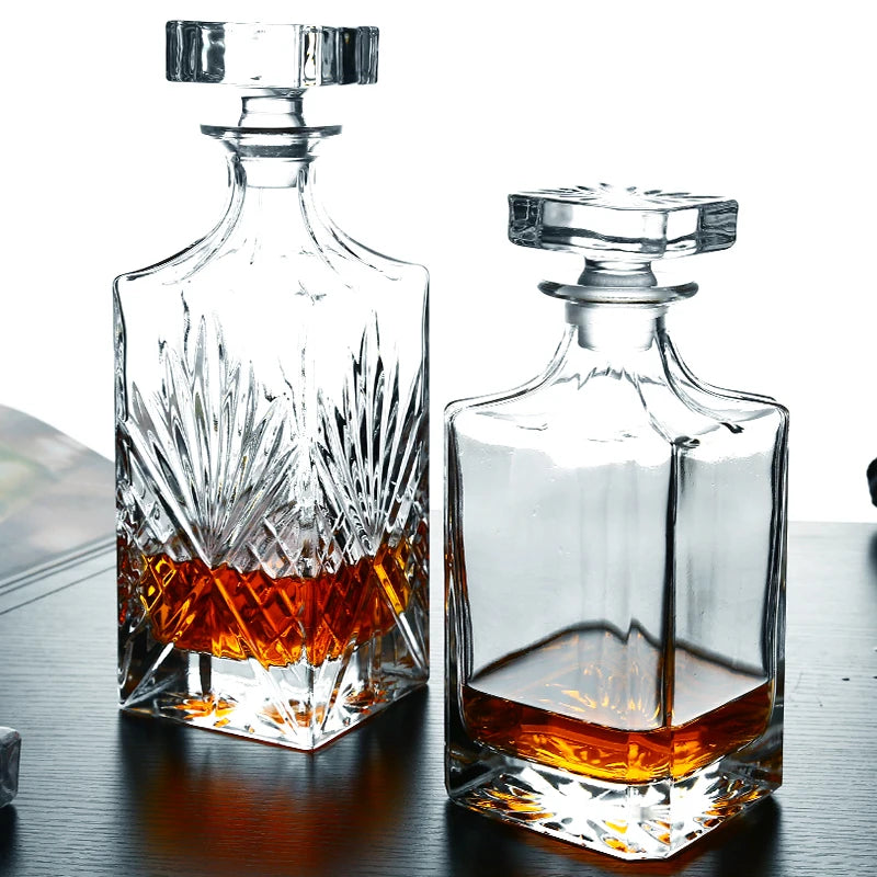 Two crystal whiskey decanters from RyeCentral with modern and classic cuts, showcasing premium craftsmanship and clarity.