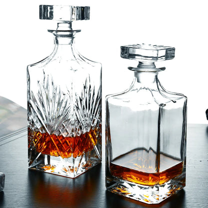 Two crystal whiskey decanters from RyeCentral with modern and classic cuts, showcasing premium craftsmanship and clarity.