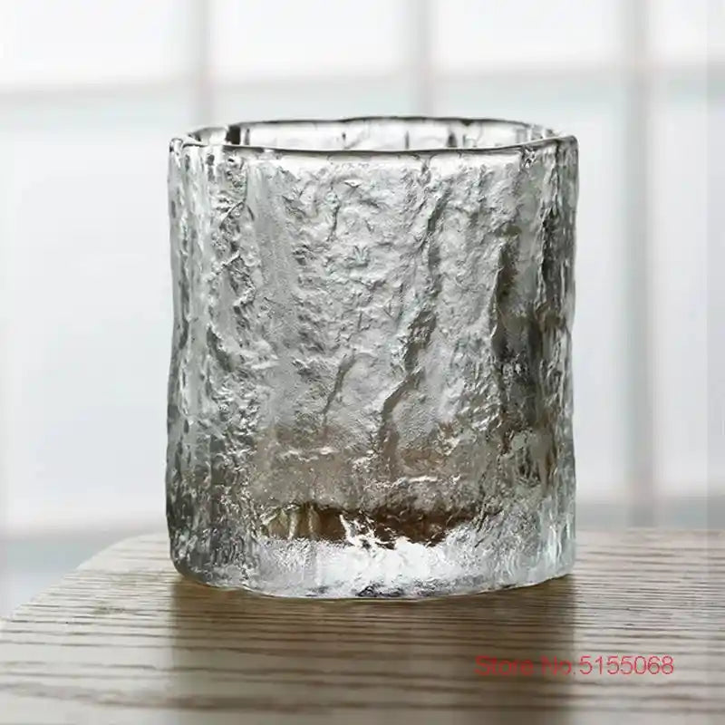 Close-up of frosted whiskey tumbler with rugged crystal texture and Japanese Nordic design, perfect for elegant home bar setups.