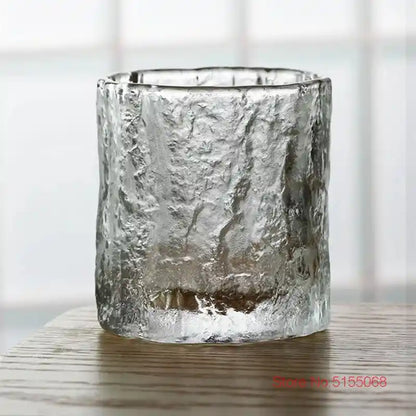 Close-up of frosted whiskey tumbler with rugged crystal texture and Japanese Nordic design, perfect for elegant home bar setups.
