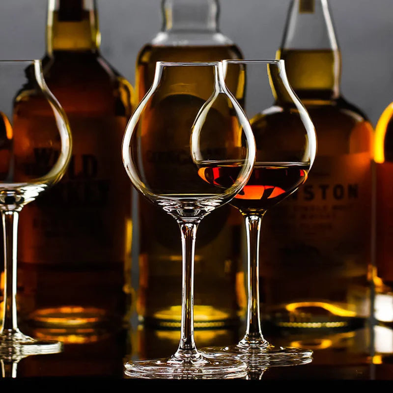 Clear whiskey tulip glasses with whiskey