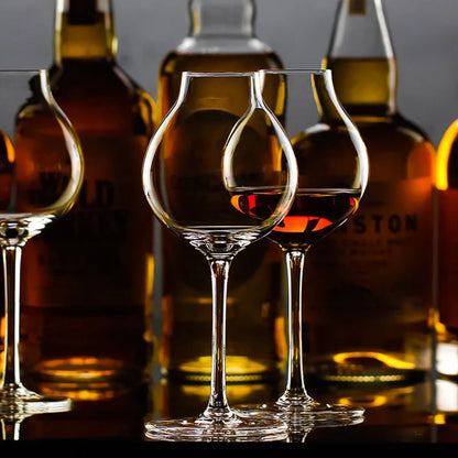 Clear whiskey tulip glasses with whiskey