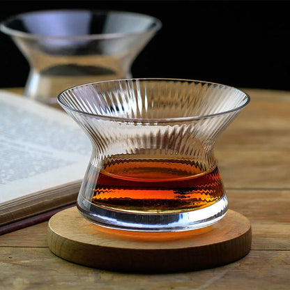 Edo Kiriko crystal whiskey glass close-up showing intricate cut pattern on spinning wooden base