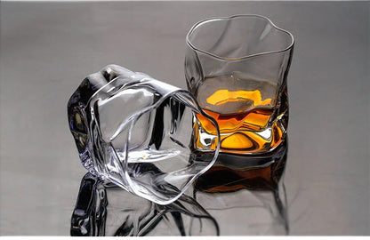 Crystal whiskey glass with amber liquor, Japanese style design