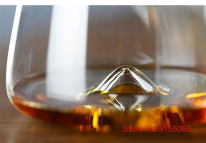 Close-up of whiskey glasses with whiskey and unique glass design