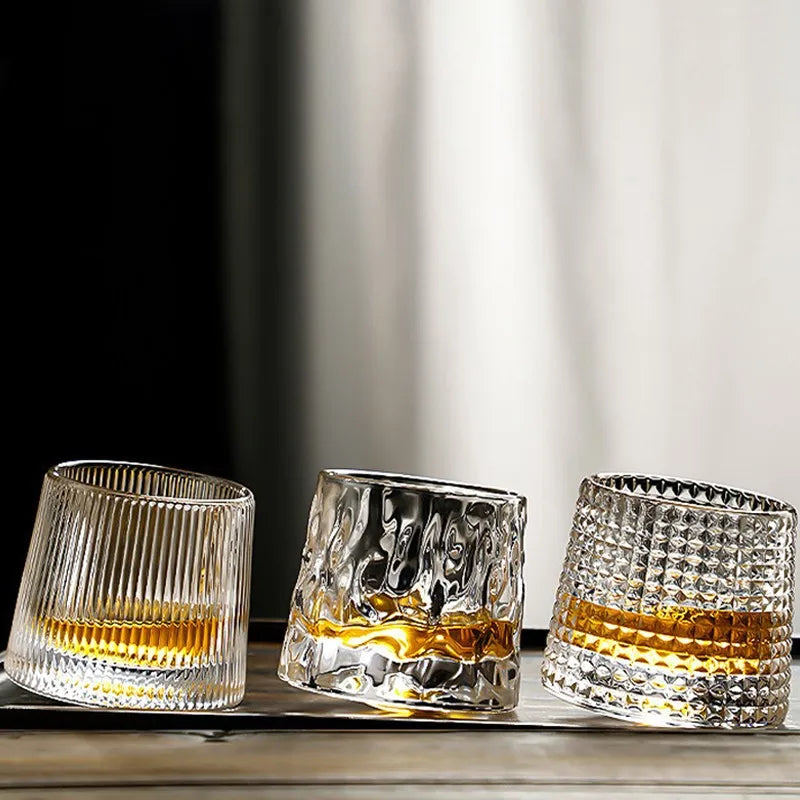 Set of textured whisky glasses with amber drink