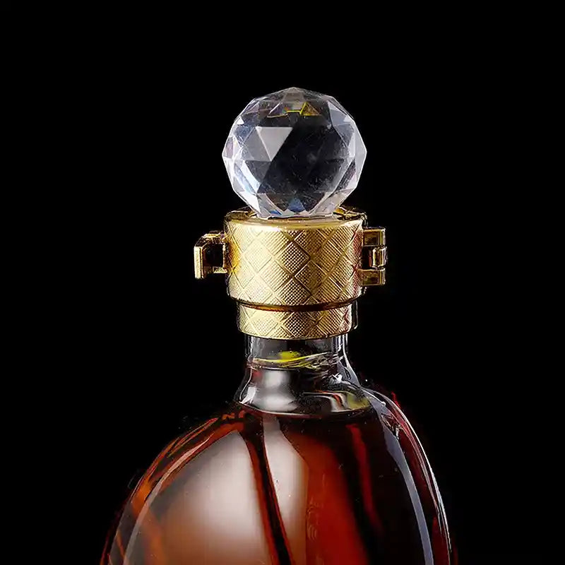 Close-up of the crystal stopper and gold-tone neck of the high heel glass whiskey decanter, showcasing elegant craftsmanship and detail.