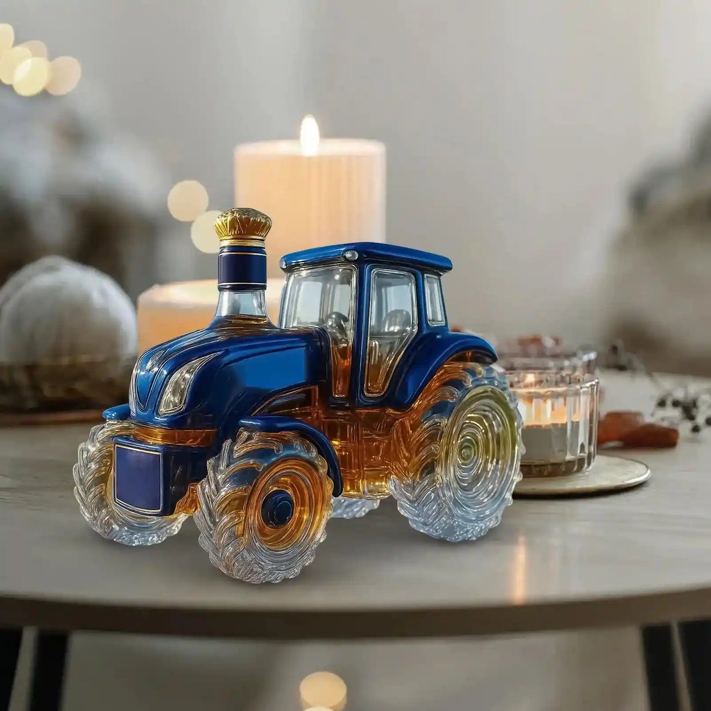 Glass Tractor Decanter in blue and amber on a candlelit table, creating a warm and elegant ambiance for home bar décor.