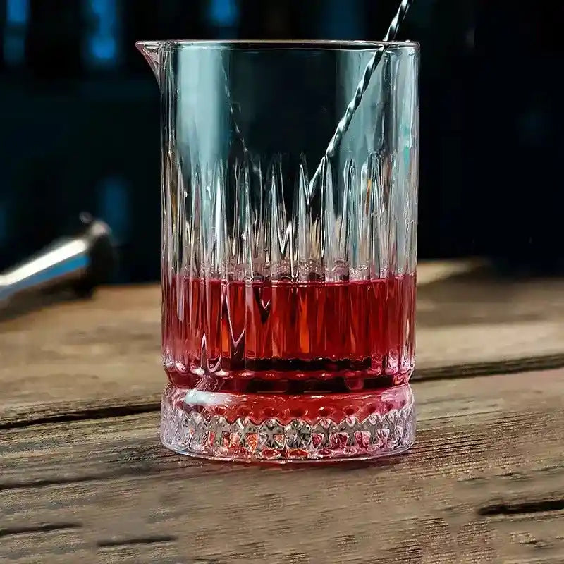 700ml crystal stirring cup with red cocktail and textured base, used for professional bartending and drink mixing.