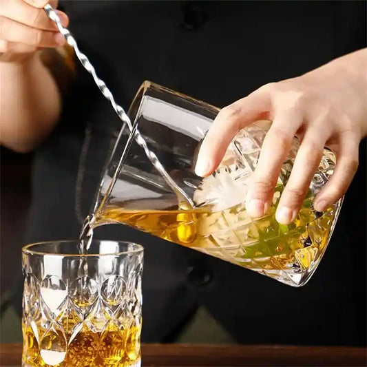 700ml crystal whiskey glass cup used by bartender to pour mixed cocktail into tumbler, ideal for professional bar use.