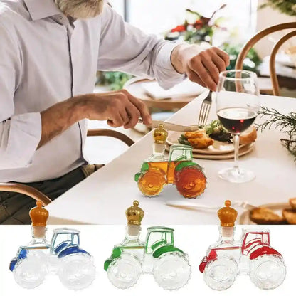 Miniature Glass Tractor Decanters in red, green, and blue on a dining table, adding playful elegance to a wine-paired meal.