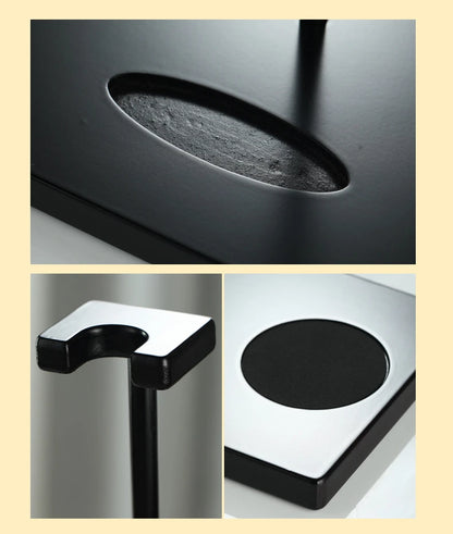 Close-up of black decanter stand and coaster