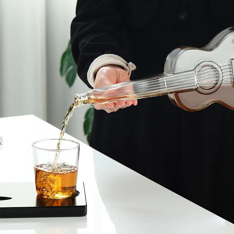 Pouring whiskey into glass from guitar decanter, elegant home bar