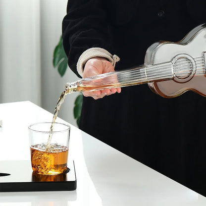 Pouring whiskey into glass from guitar decanter, elegant home bar