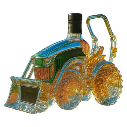 Shiny glass tractor decanter with black cap and loader, perfect for unique whiskey and wine presentation in home bars.
