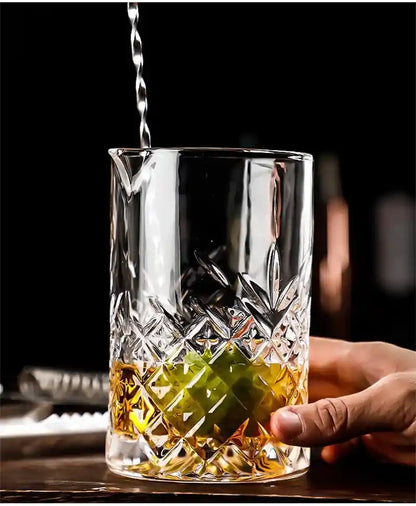 Close-up of 700ml crystal cocktail shaker with lime and whiskey, used for professional bartending and drink mixing.