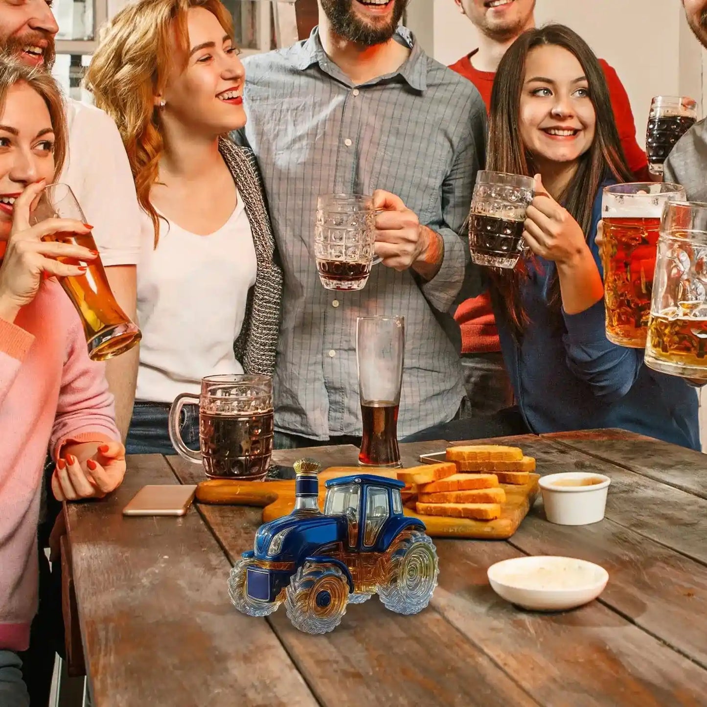 Glass Tractor Decanter featured at a lively party, surrounded by friends enjoying beer, adding charm to the celebration table.