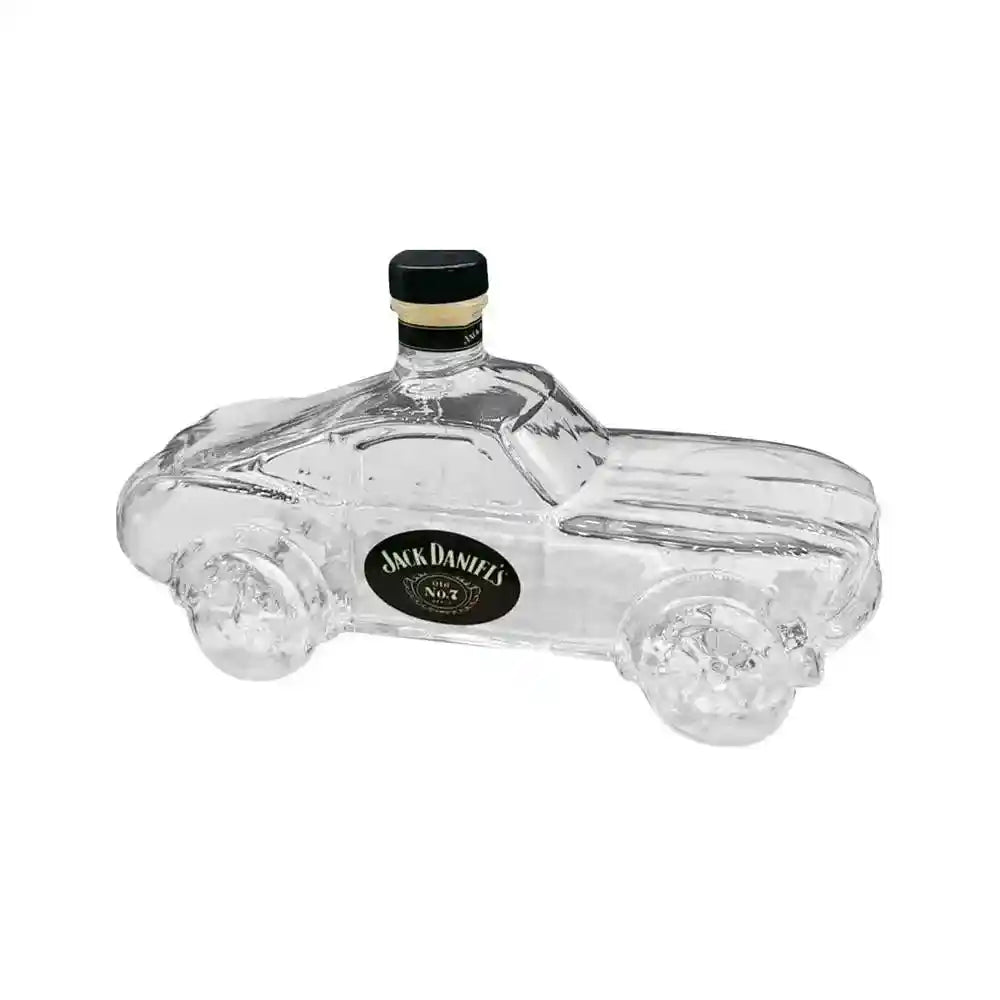 Clear glass car-shaped decanter with Jack Daniel's label, combining novelty design with whiskey storage functionality.