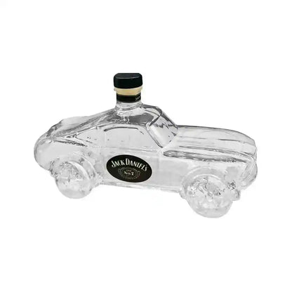 Clear glass car-shaped decanter with Jack Daniel's label, combining novelty design with whiskey storage functionality.